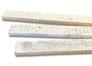 3 inch wide reclaimed wood trim pieces in a white wash finish.