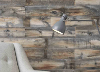 Light reclaimed wood in grey and brown hues on a wall in a modern office.