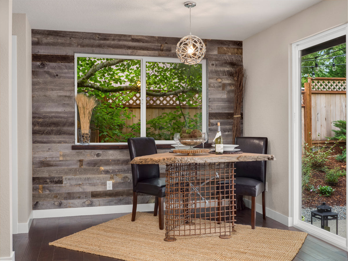 Grey and brown reclaimed wood accent wall in a kitchen in Washington state. Overall theme of the kitchen is modern rustic. Reclaimed wood wall planks from Centennial Woods.