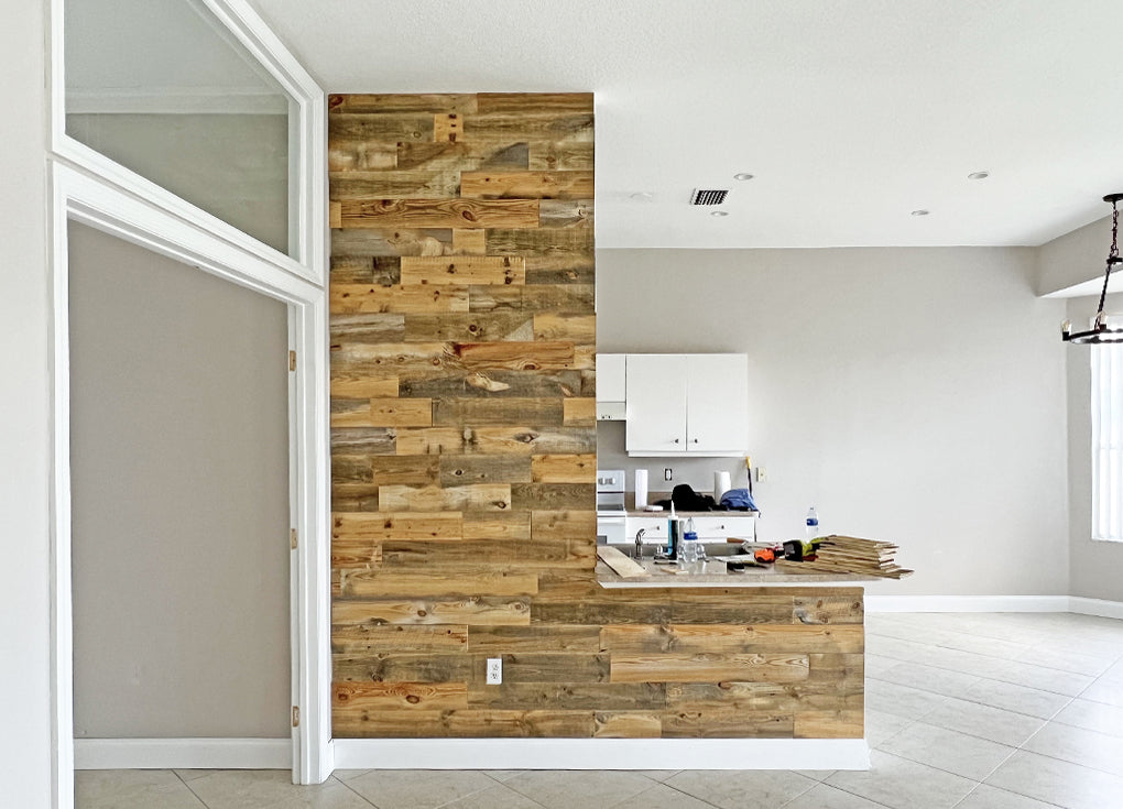 L-shaped accent wall in the Cheyenne finish from Centennial Woods in a bright white open floor plan