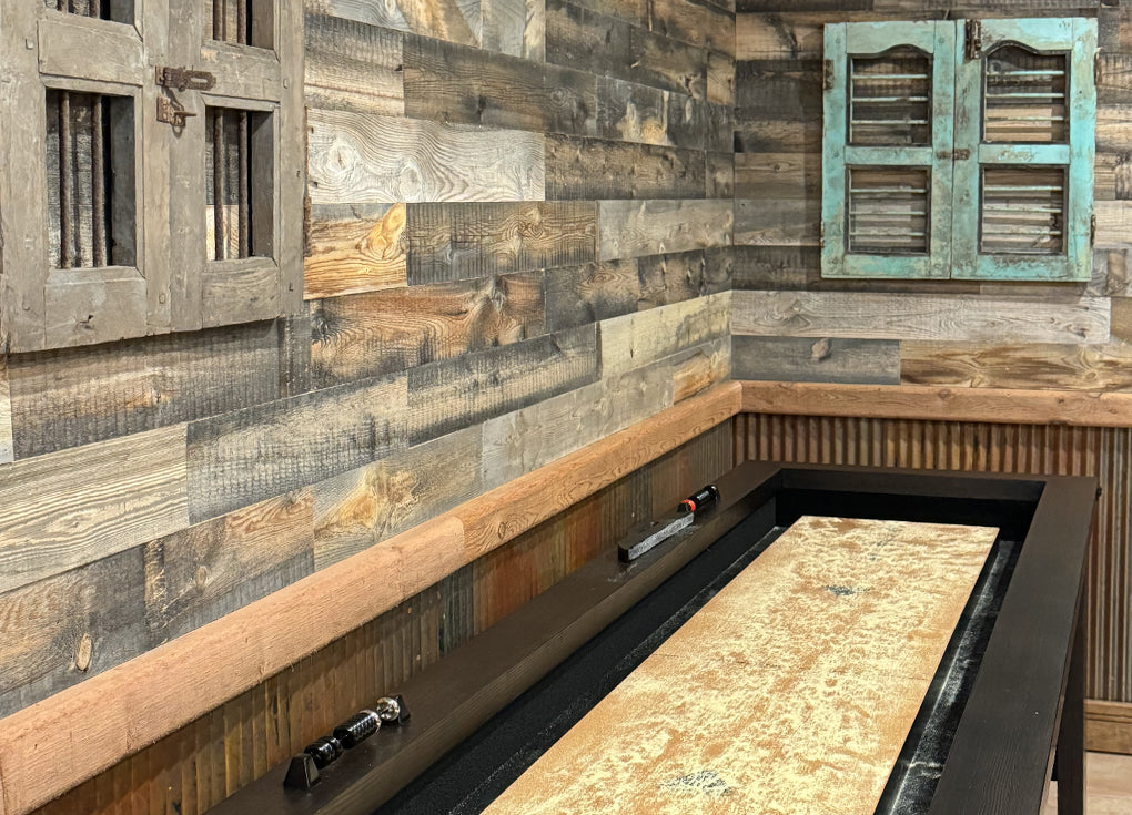 Rustic styled gameroom with a shuffleboard and reclaimed wood walls