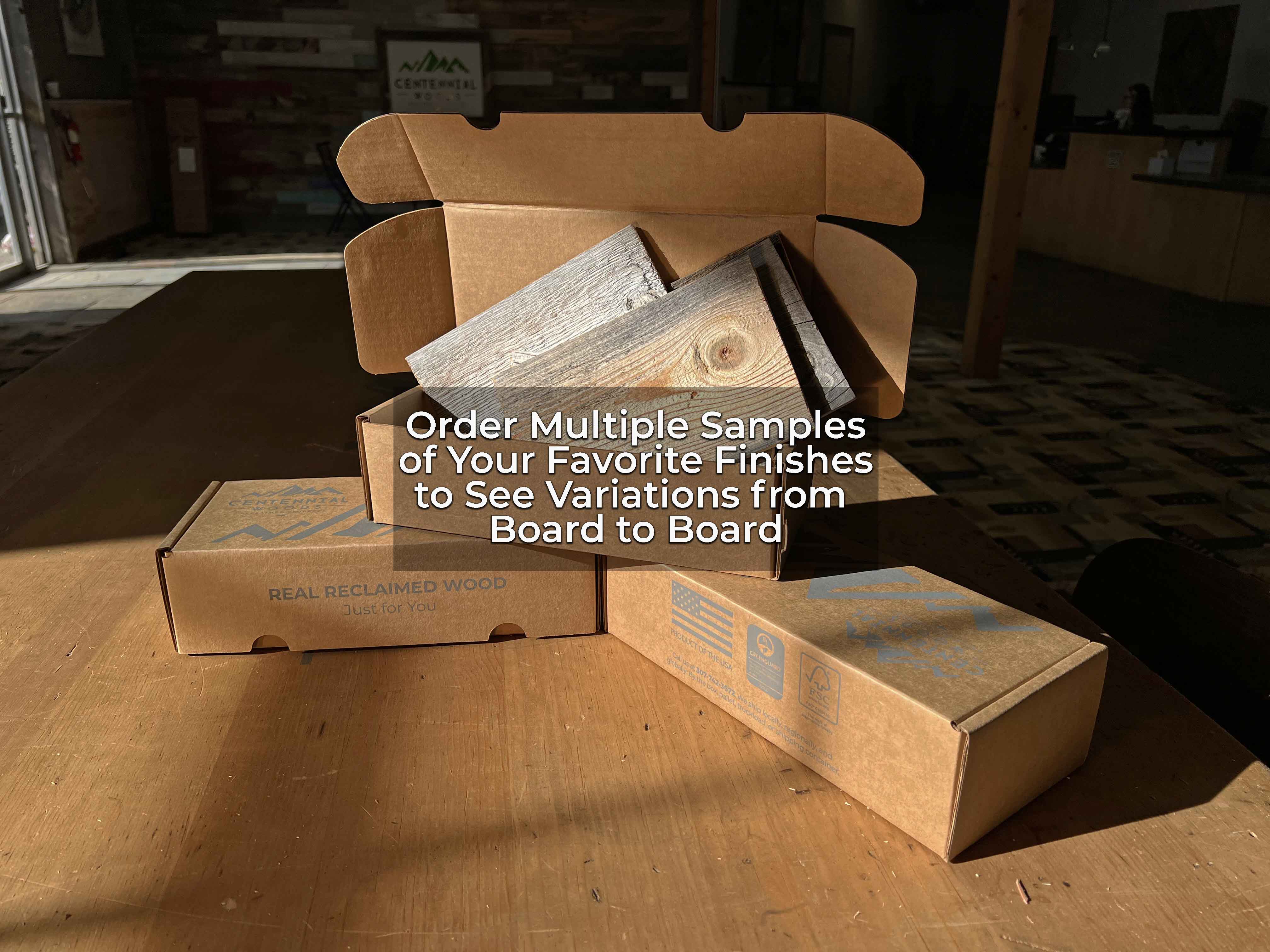 Cardboard sample boxes containing free reclaimed wood samples from Centennial Woods