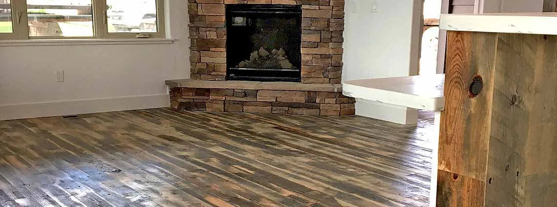 reclaimed wood flooring installed in a living room.