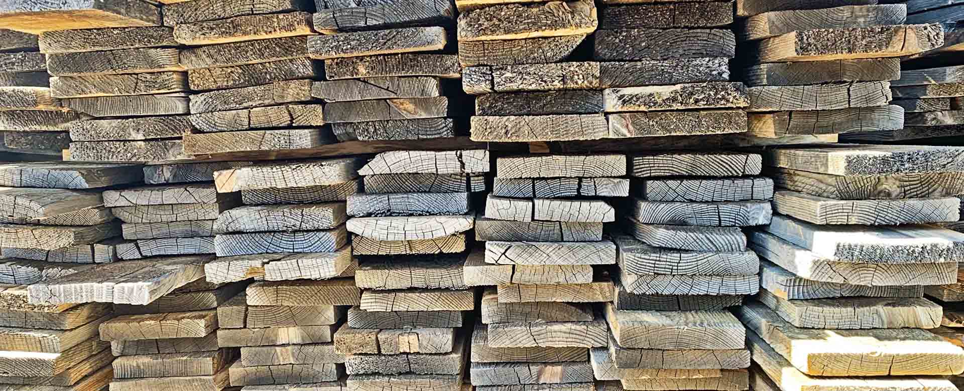 Stacked boards of reclaimed 1x6 for sale from Centennial Woods