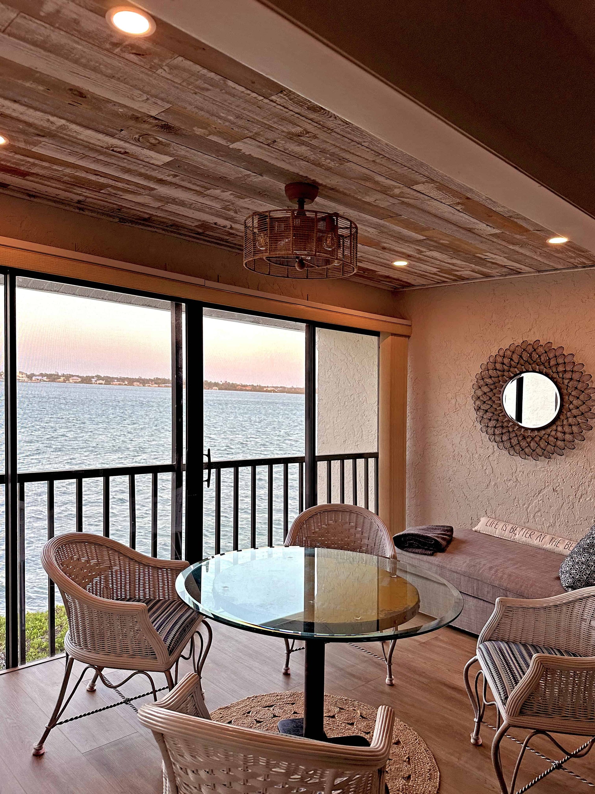 White painted reclaimed wood ceiling in a coastal balcony