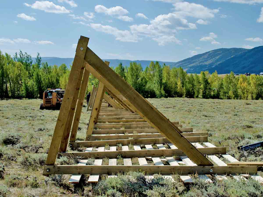 A snow fence under construction in the town of Centennial in Southeast Wyoming.