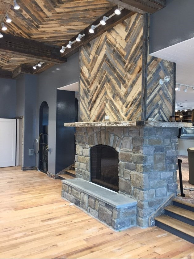 Fireplace surround made with Wheatland reclaimed wood planks