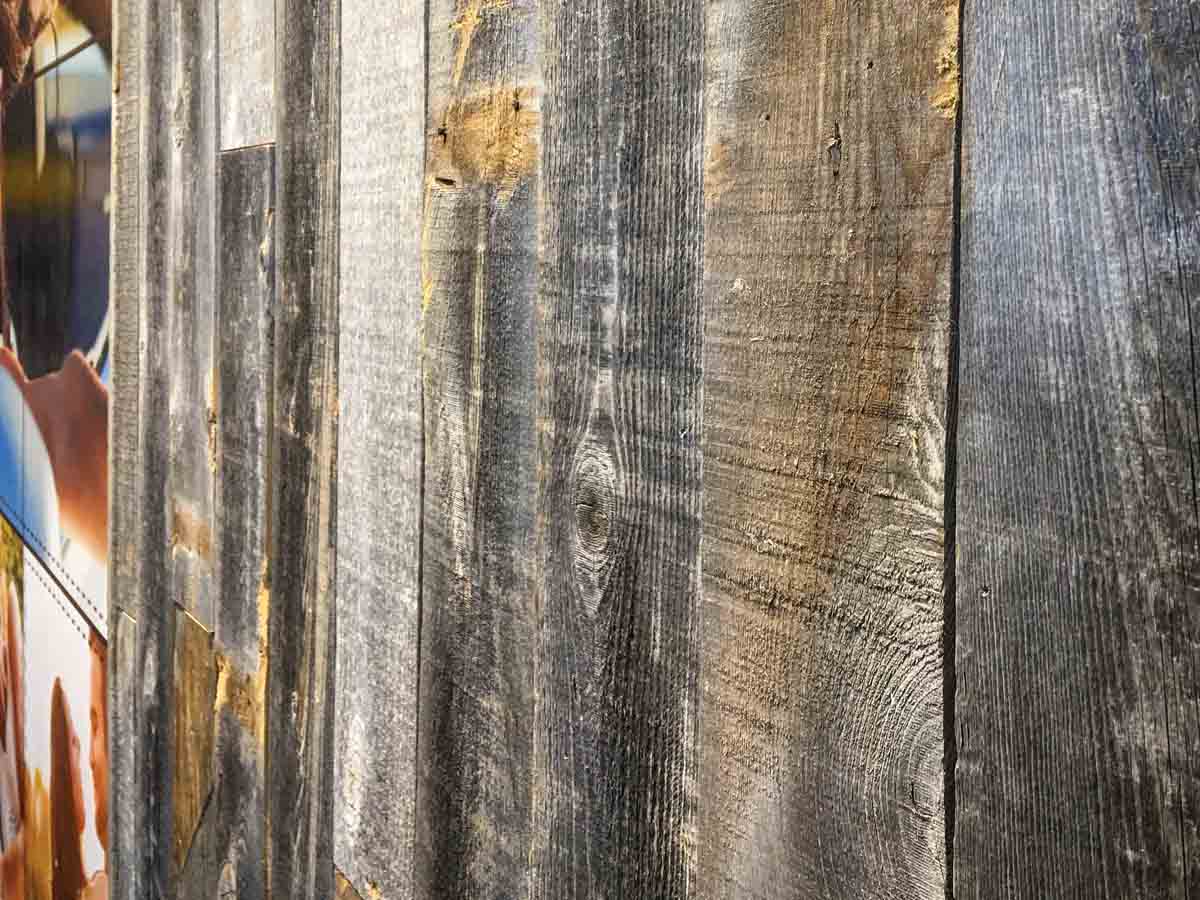 Centennial Woods' reclaimed wood planks installed vertically in a business entryway.