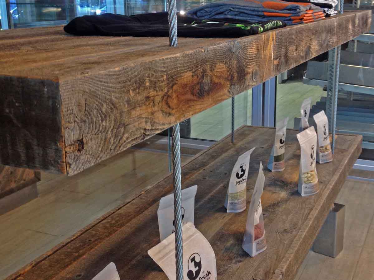 Custom reclaimed wood shelving in a restaurant gift shop.