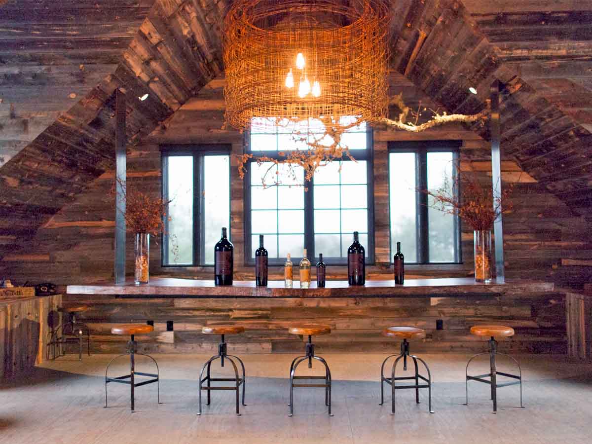 Wine tasting room at Phifer Pavitt Winery clad in reclaimed wood planks from Centennial Woods.