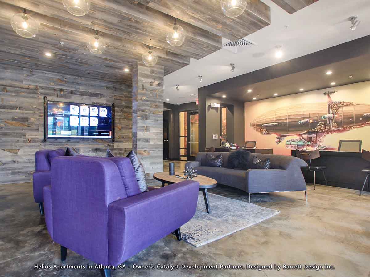 Reclaimed wood wall design on walls, beams, and posts used as a biophilic design element in a modern apartment building lobby in Georgia.