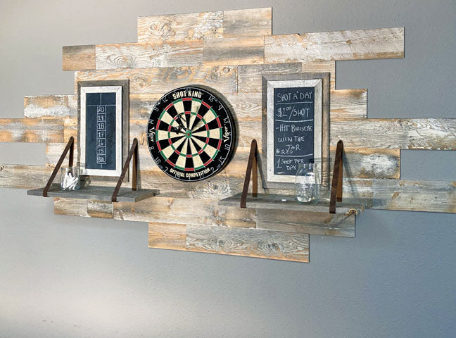 Distressed whitewash wood paneling on a wall used for a background for a dartboard