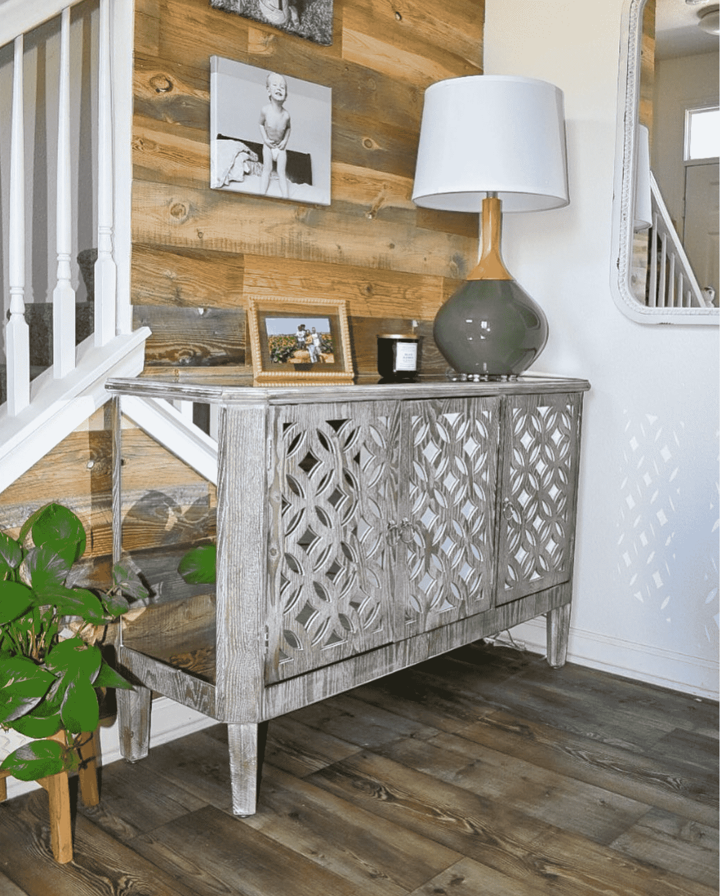A half wall along a stair case clad in reclaimed wood in the Cheyenne finish