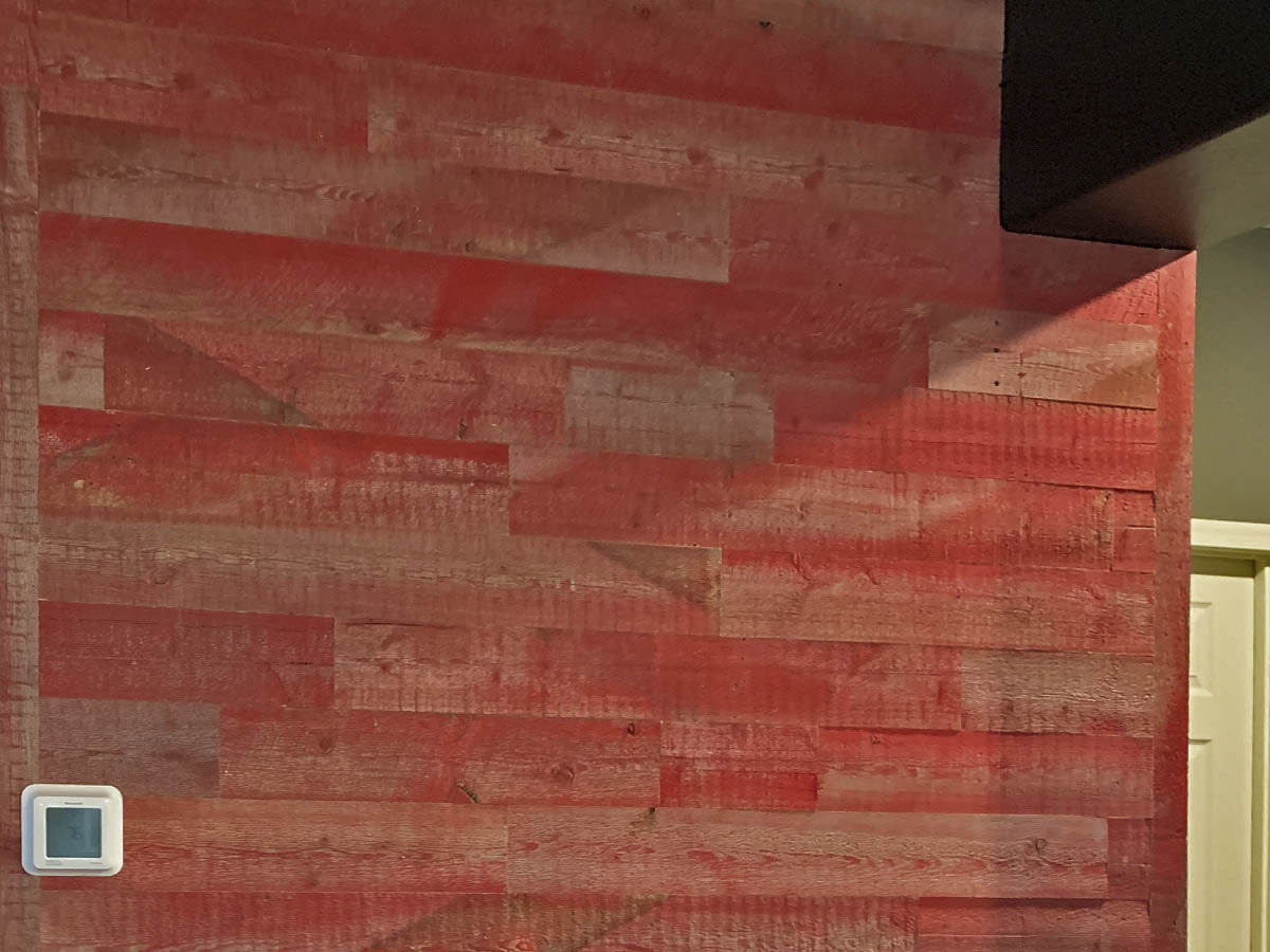 Red barn wood wall planks in an entryway