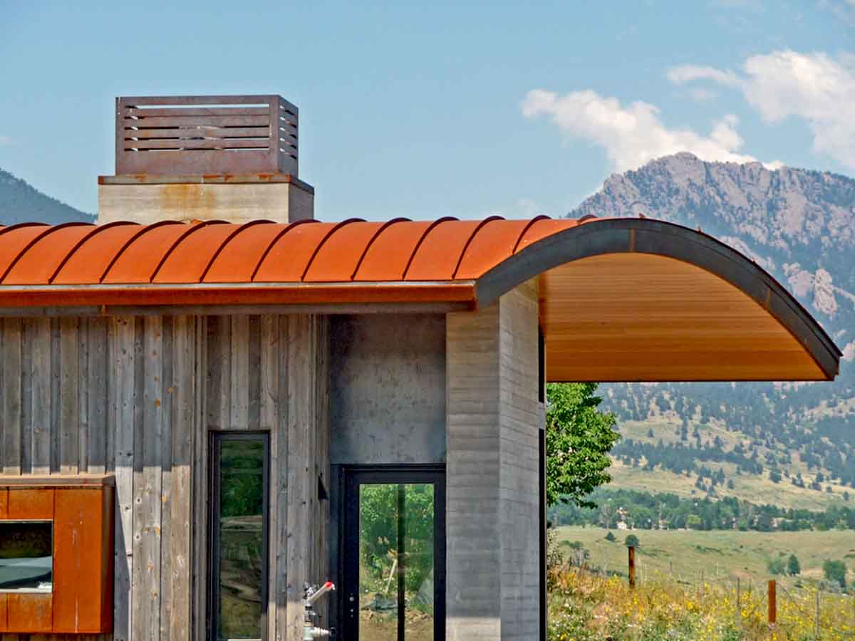 Modern home with a vertical reclaimed wood facade by Barret Studio Architects.