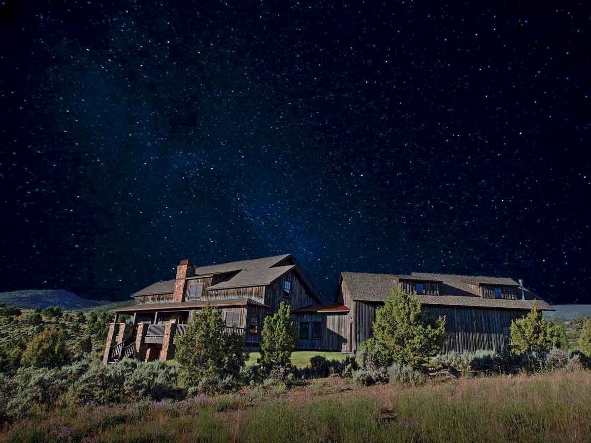 Reclaimed wood siding milled from recycled Wyoming snow fence boards on a modern home.