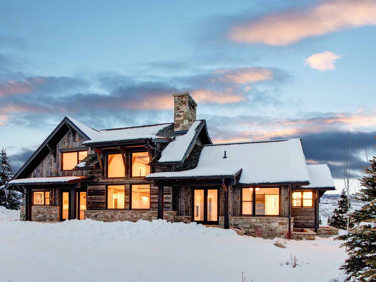 Rustic ski house in Park City, UT with horizontal and vertical reclaimed wood siding.