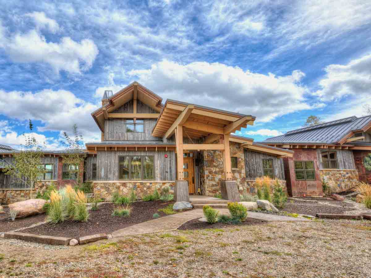Modern mountain home in Steamboat Springs, CO with light grey vertical reclaimed wood siding.