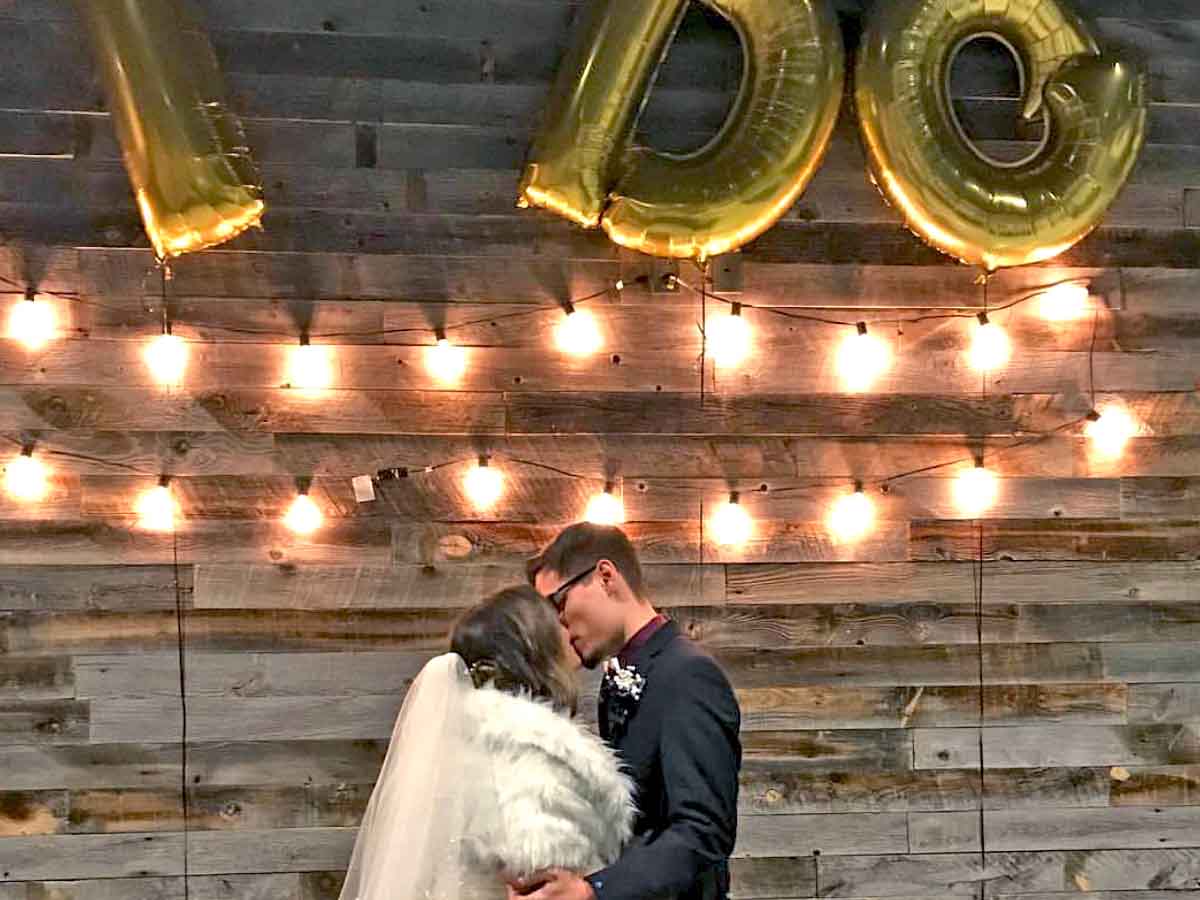 Wedding venue with a reclaimed wood accent wall from Centennial Woods.