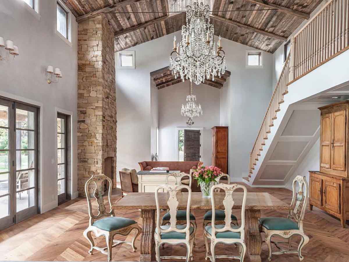 Modern rustic dining room with a reclaimed wood ceiling from Centennial woods in a Malibu, CA home.