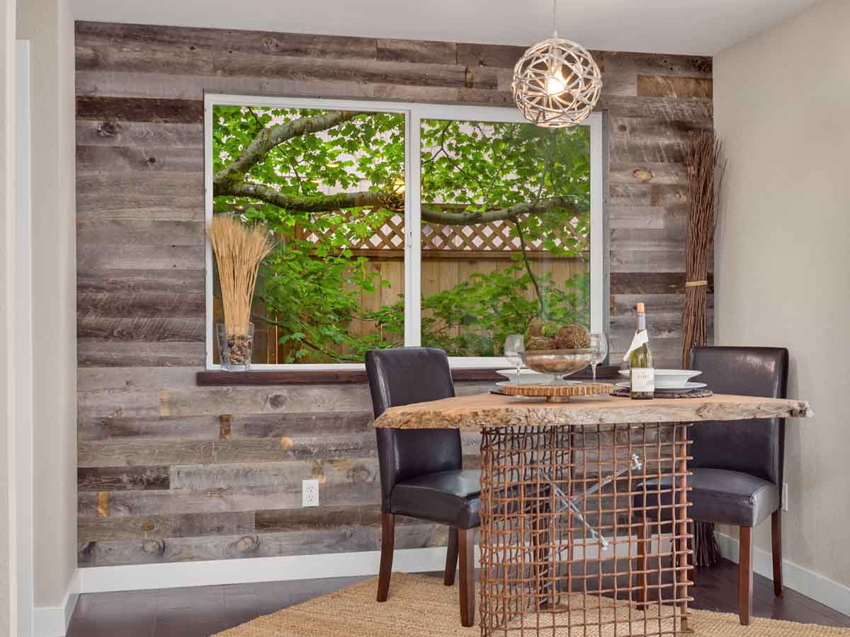 Grey reclaimed wood accent wall in a kitchen in Washington state.