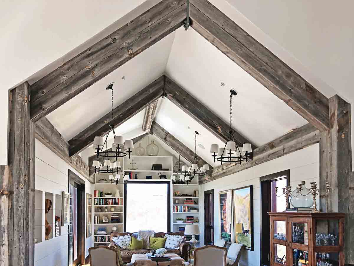 Reclaimed wood post and ceiling beams in a farmhouse style home.