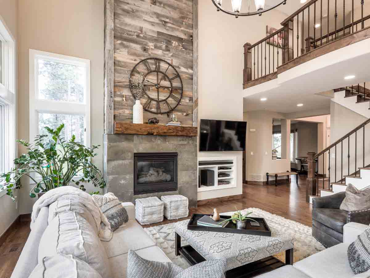 Light grey reclaimed wood fireplace surround in a modern farmhouse style home's rv room.