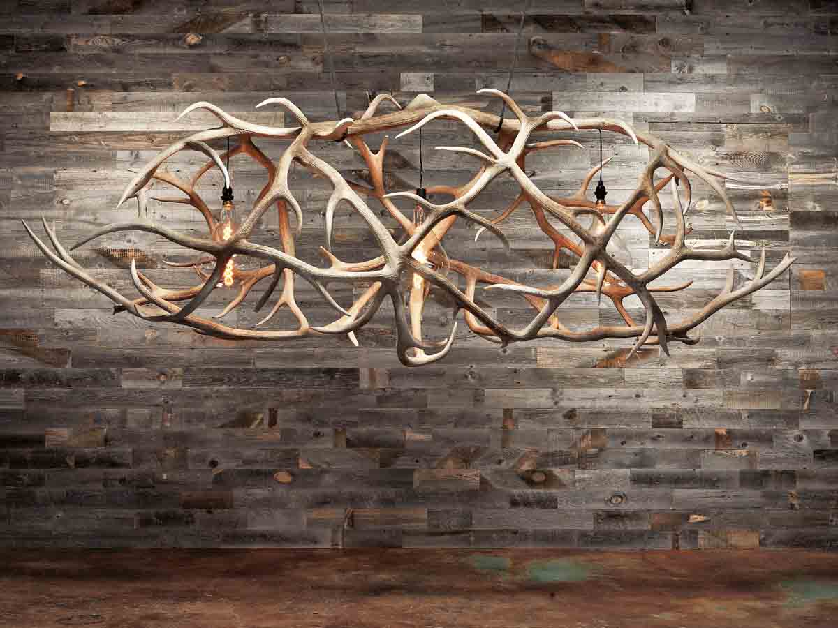 Reclaimed wood wall and custom antler chandelier from Show Rivett in Wyoming.