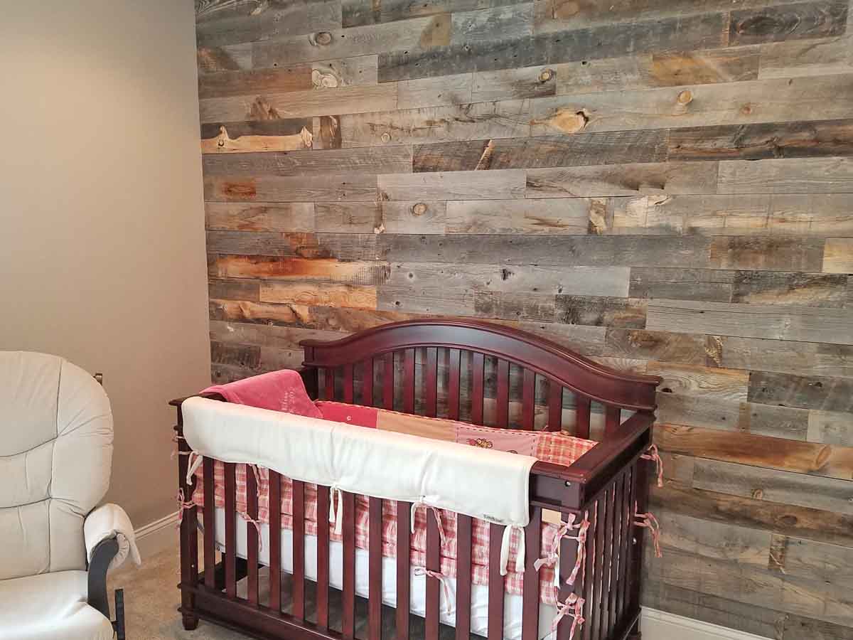 GREENGUARD Gold certified, grey reclaimed wood accent wall in a nursery from Centennial Woods.