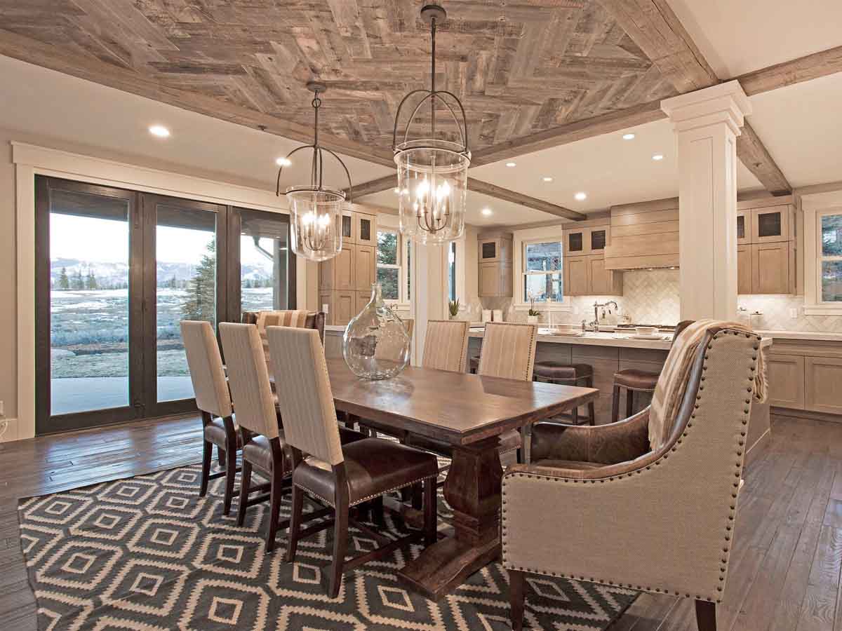 Light colored, herringbone reclaimed wood ceiling in a modern rustic Utah mountain home's dining room.