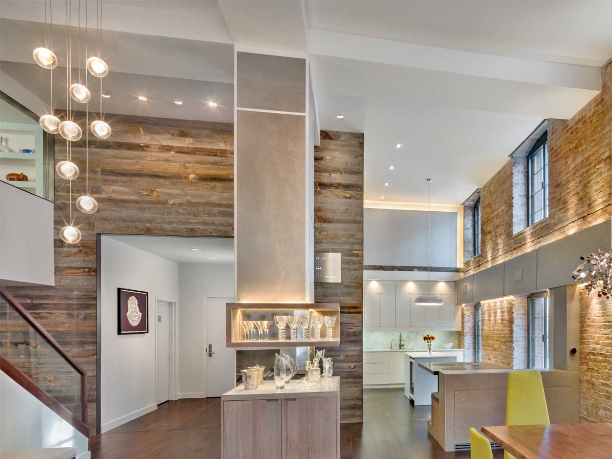 NYC loft with a reclaimed wood accent wall from Centennial Woods designed by Rodriguez Architecture.