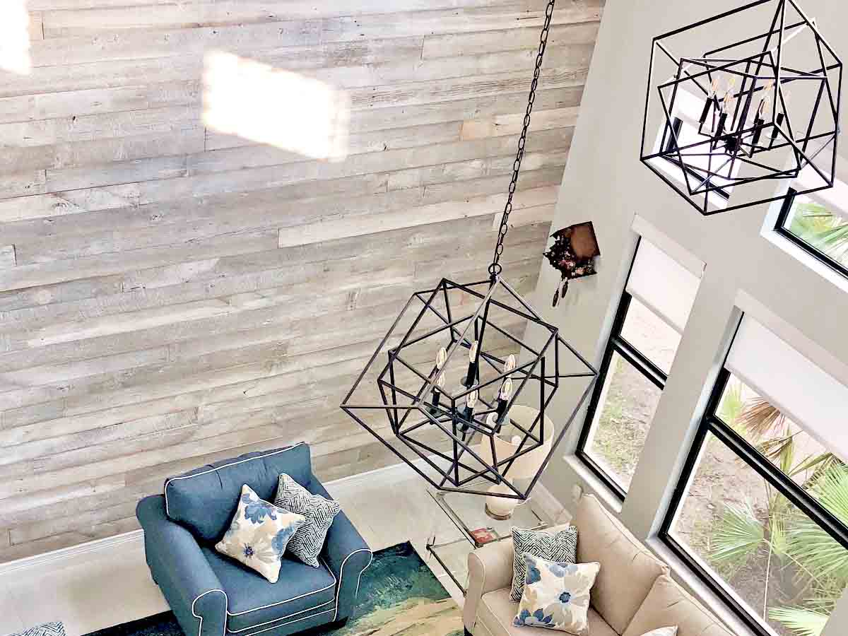 Reclaimed wood accent wall in painted white in a coastal living room in Florida.