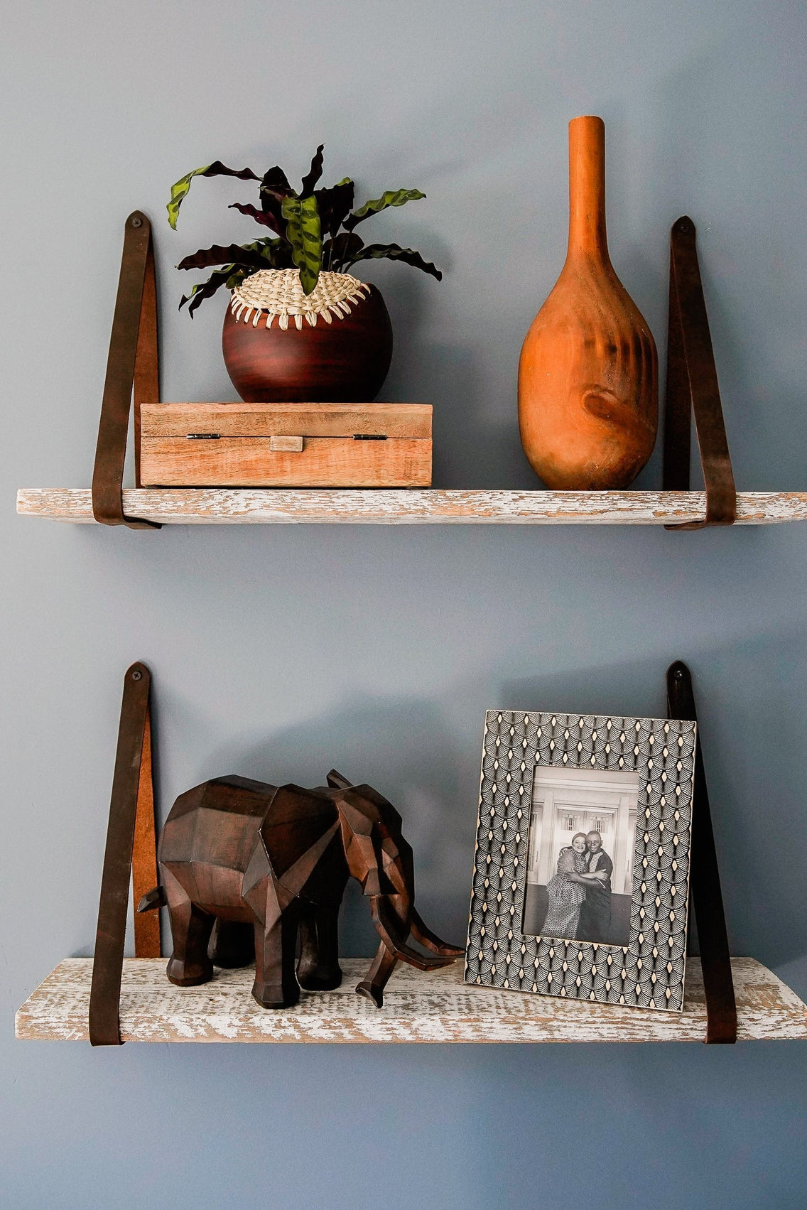 White washed reclaimed wood wall shelves with leather straps as seen on HGTV Extreme Makeover Home Edition