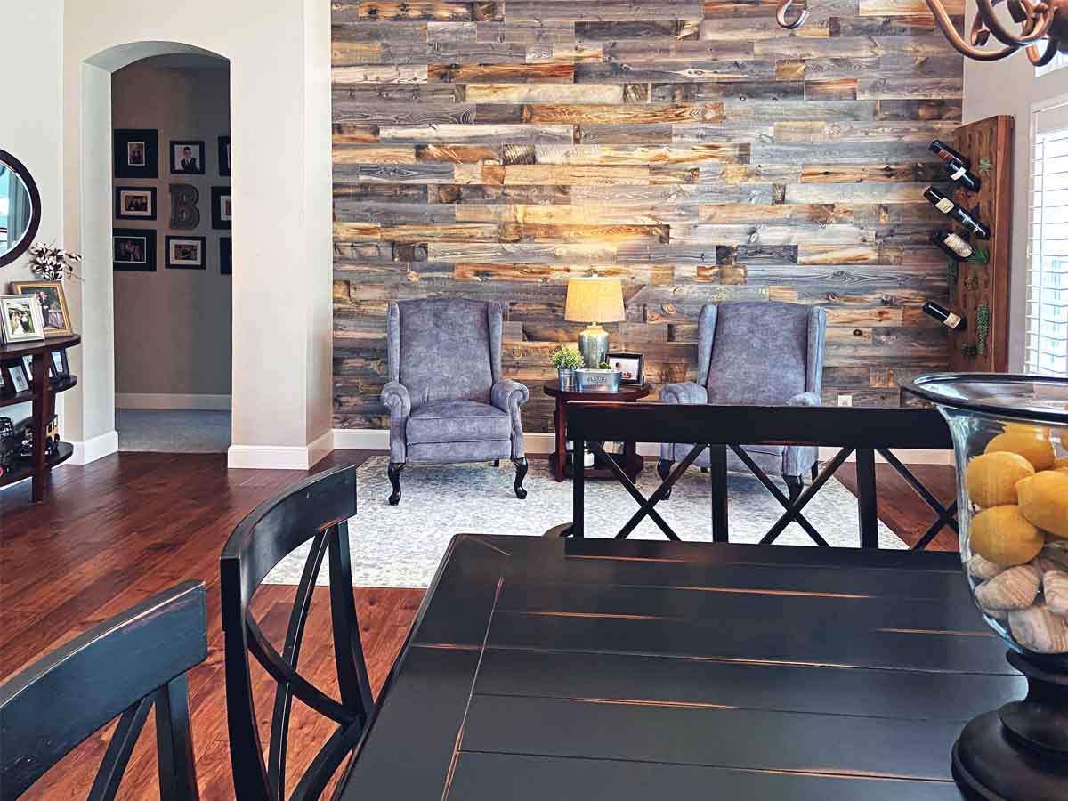 Grey and brown wood feature wall in a farmhouse style dining room.