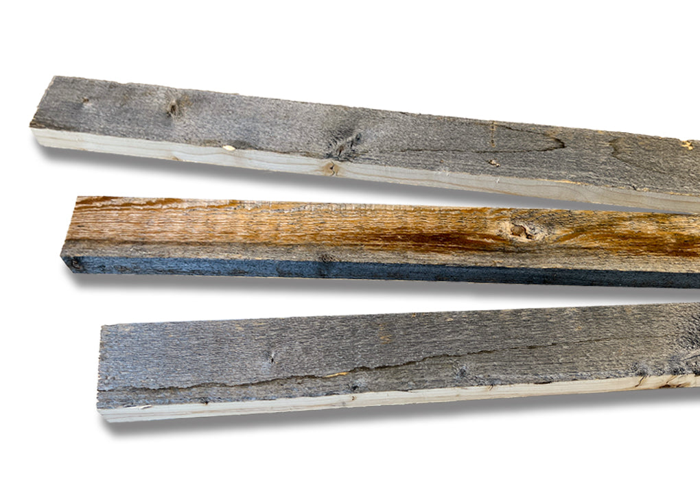 3 inch wide reclaimed wood trim pieces varying in color from gray to brown