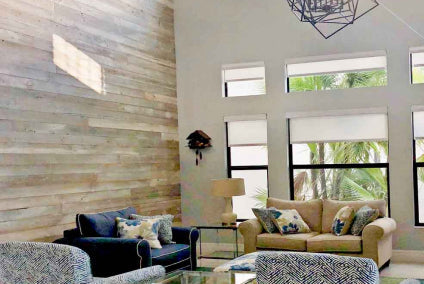 White wash reclaimed wood planks installed on a living room wall in Florida