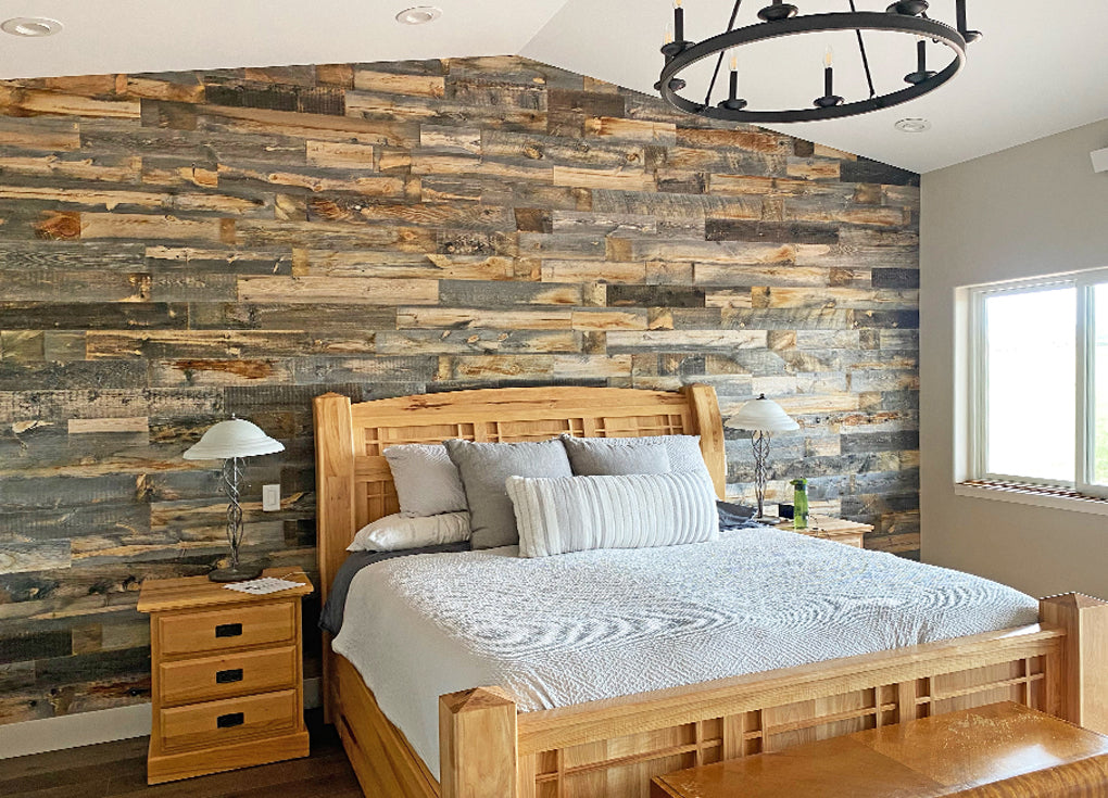 Cody reclaimed wood wall in a bedroom with a vaulted ceiling 