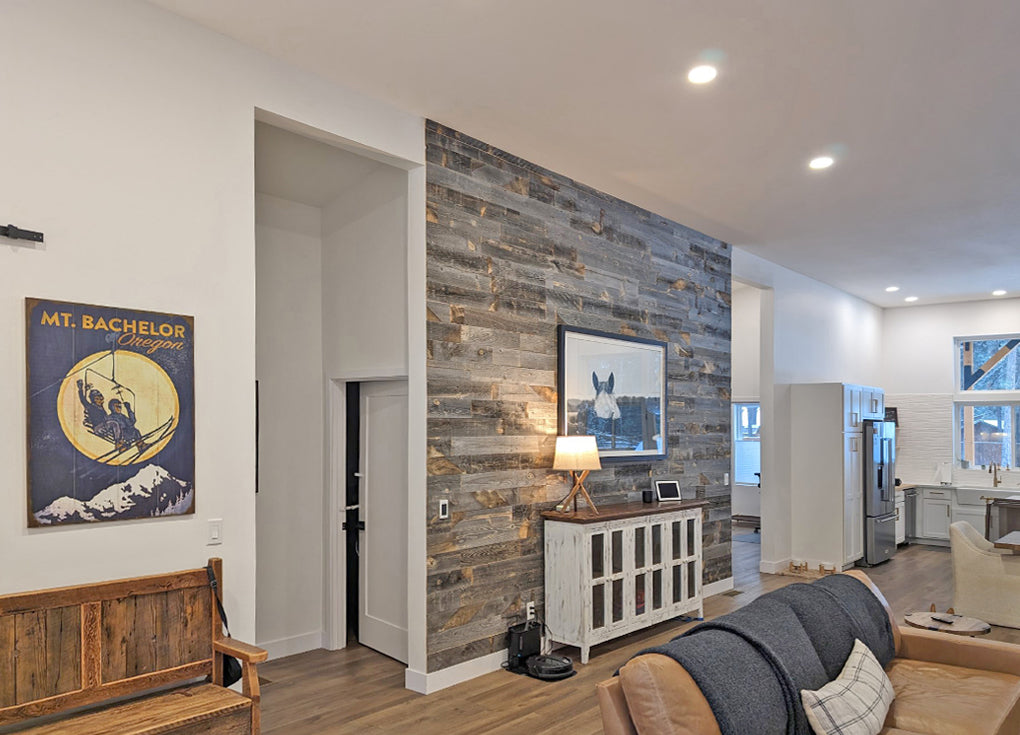 Gray reclaimed wood accent wall in an open floor plan room