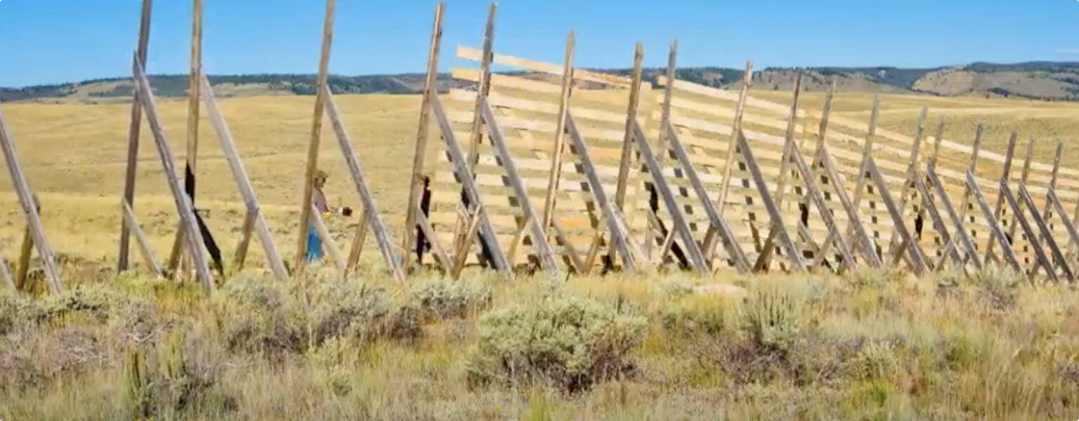 Wooden snow fence construction and installation in Wyoming