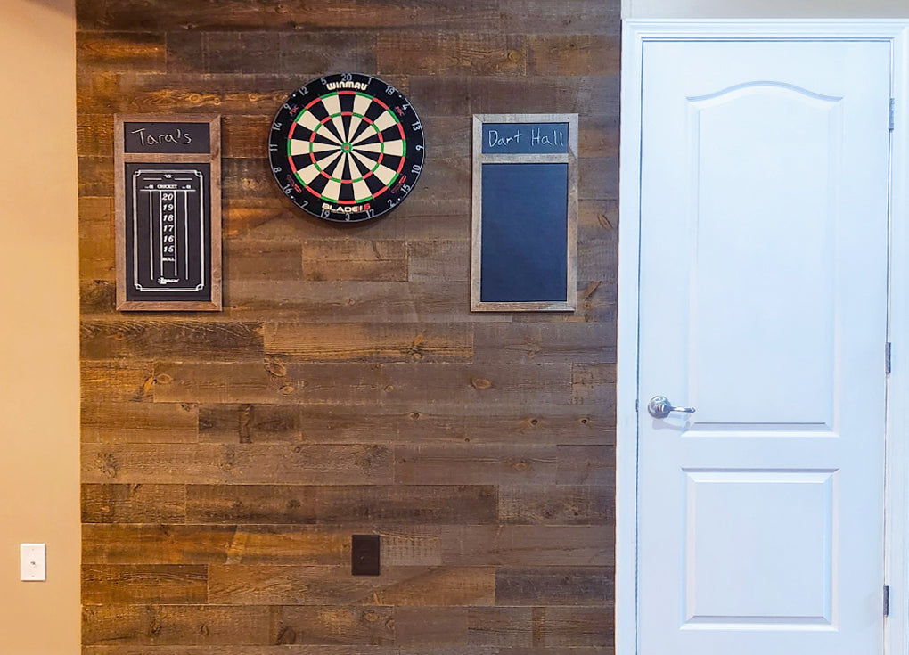 reclaimed wood wall in brown used as a background for a dart board