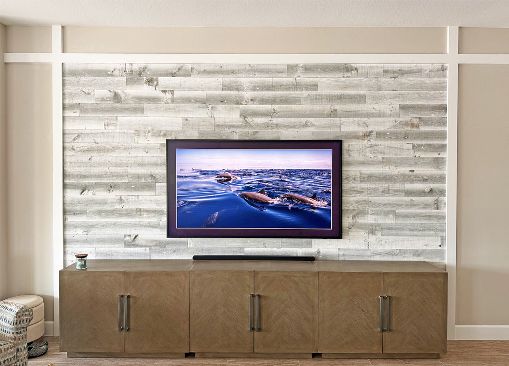 Board and batten style accent wall in a mid-century modern tv room in Florida.
