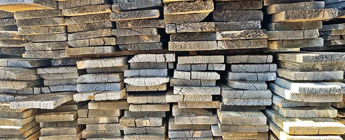 Stacked boards of reclaimed 1x6 for sale from Centennial Woods