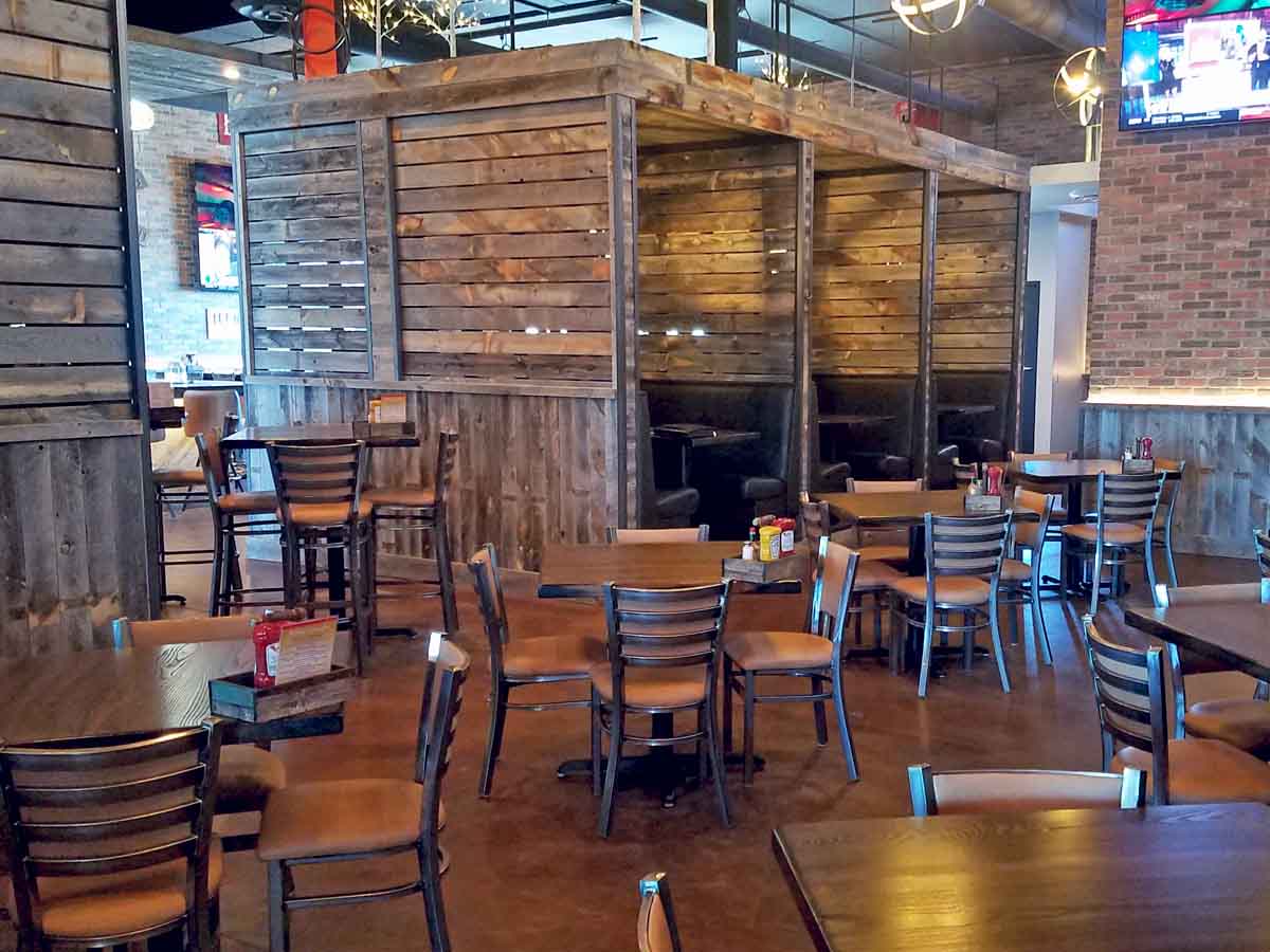 Creative use of reclaimed wood planks from Centennial Woods at Cunningham's Journal in Kearney