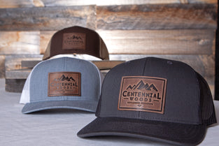 Baseball caps with leather Centennial Woods logo