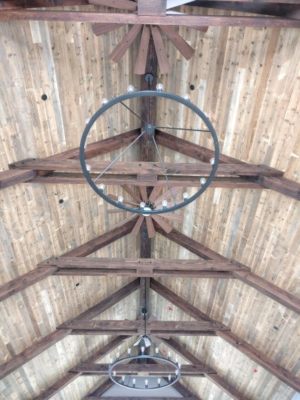 Farmhouse reclaimed wood ceiling with custom light fixtures 