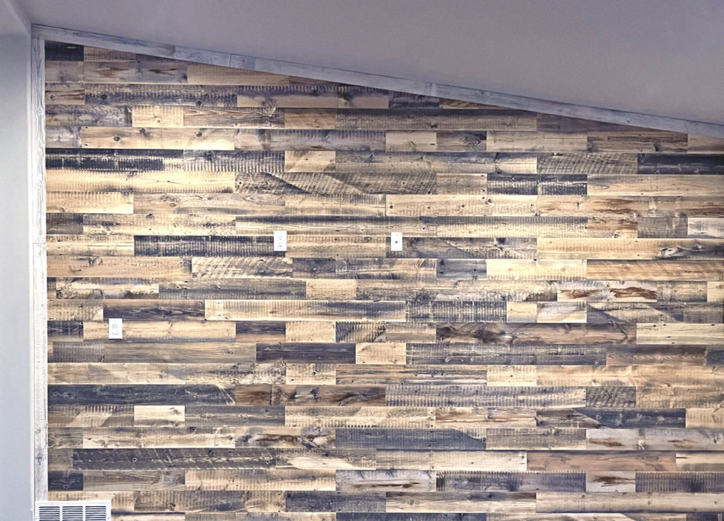 Reclaimed wood planks on a wall in a room with an angled ceiling