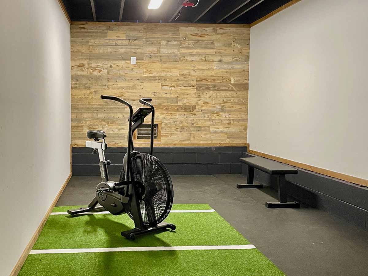 home gym reclaimed wood wall