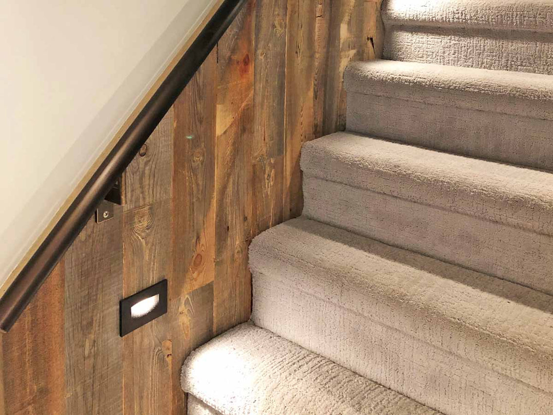 Distressed wood wall on a staircase with brown tones|.