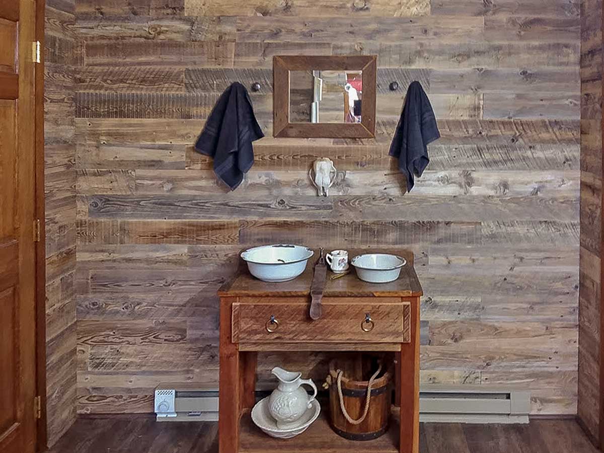 Reclaimed wood walls in a bathroom inside a home in Idaho