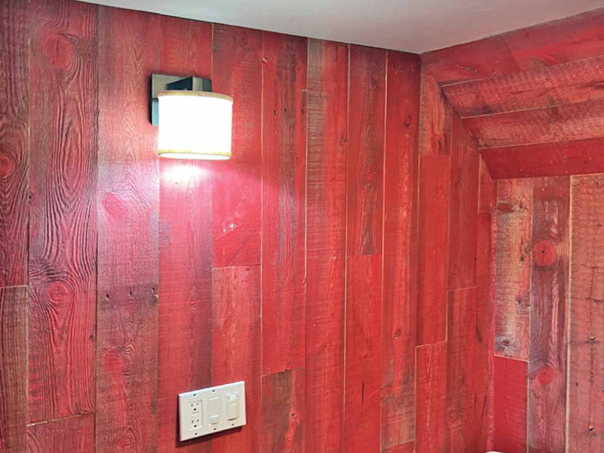 Red barn wood wall with angled ceiling